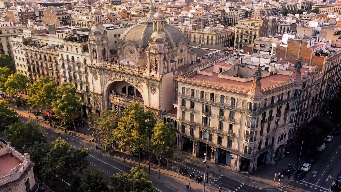 Aerial view of a grand city boulevard and its domed corner building